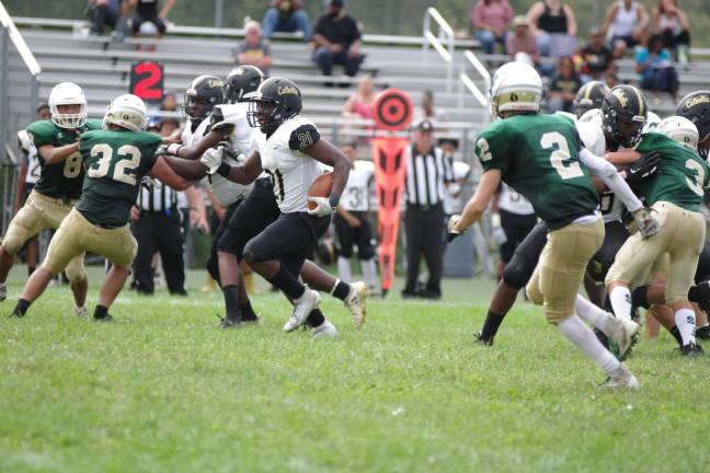 In the third quarter Hudson Catholic running back Jalen Best advances the ball up the middle.