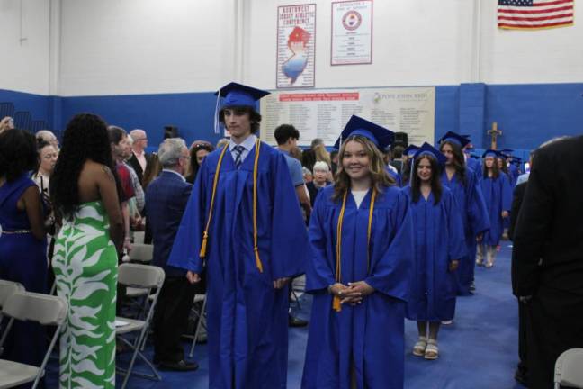 Pope John XXIII Regional High School graduation photos Graduates march down the aisle to their seats in the gym.