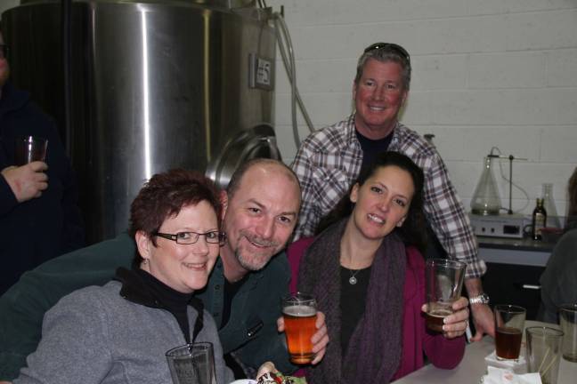 Cheers to one year Missi and Ed Muller of Hampton and Kimberly and Dave Williams of Stillwater.