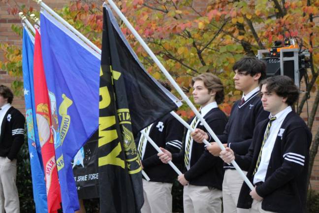 Students whose parents and siblings are active-duty service members presented the flags of the armed services.