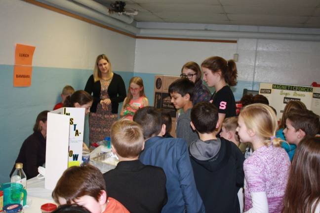 Scientists of tomorrow shine forth The crowd gathers as Madeline Gambino demonstrates her popular Insta Snow at Mohawk Avenue School’s Third Grade Science Fair.