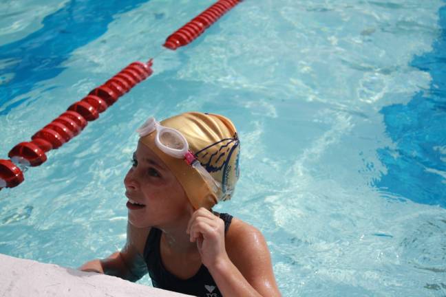 Seven-year-old simmer Ella Duphiney swam 32 laps.