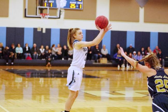 Sparta's Bailey Chapman is in the midst of a shot in the first quarter. Chapman scored 5 points.