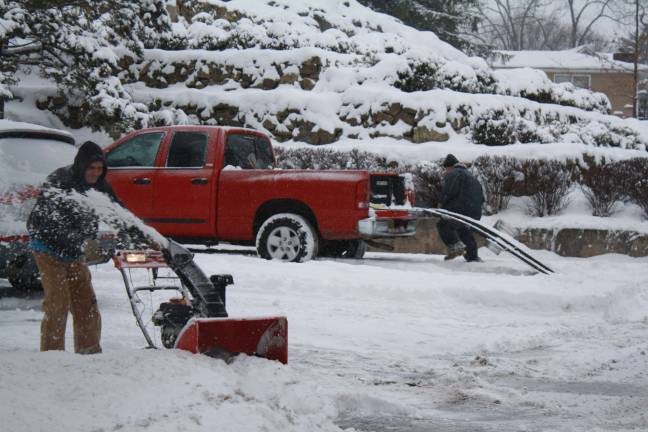 'Historic' storm never comes, but Sparta still digs out Peterson Landscapes at work in Lake Mohawk.