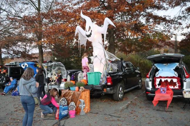 About 30 vehicles as well as the police and fire departments and ambulance squad took part in the annual Trunk or Treat on Friday, Oct. 27 in the Station Park field parking lot. (Photos by Dave Smith)