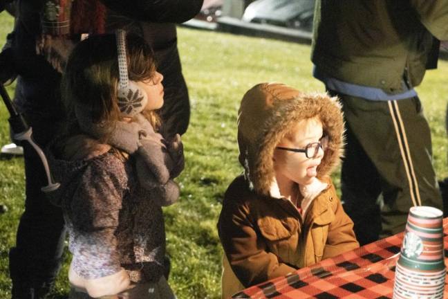 Residents wait for hot chocolate provided by Starbucks.