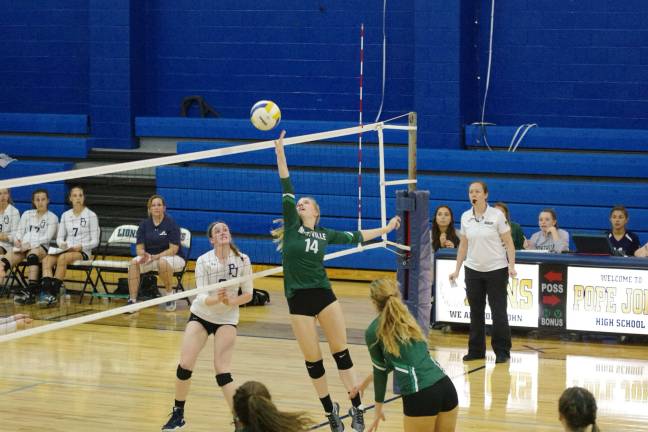 Montville tops Pope John in volleyball Montville's Maddie Morris (14) taps the ball towards the Pope John side of the net. Morris contributed five kills and three blocks.