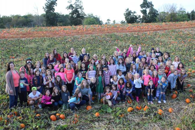 Fall fun: Troop 418 and members of a sister Girl Scout Troop enjoy their annual visit to Tranquility Farms.