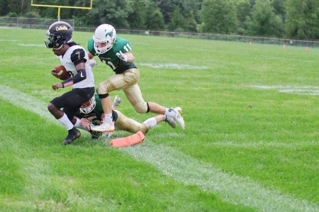 Hudson Catholic quarterback Johnathan Bates gets knocked out of bounds short of the goal line by Sussex County defenders Brendan Maroney and Ryan Kinkead (11) in the second quarter. Bates threw for 207 yards and two touchdowns.