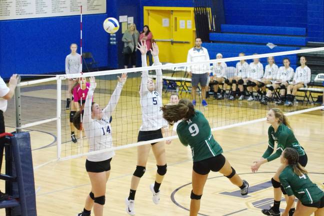 Montville tops Pope John in volleyball Montville's Reese Henderson bats the ball towards the Pope John side of the net. Henderson contributed two aces, five kills and nine digs.