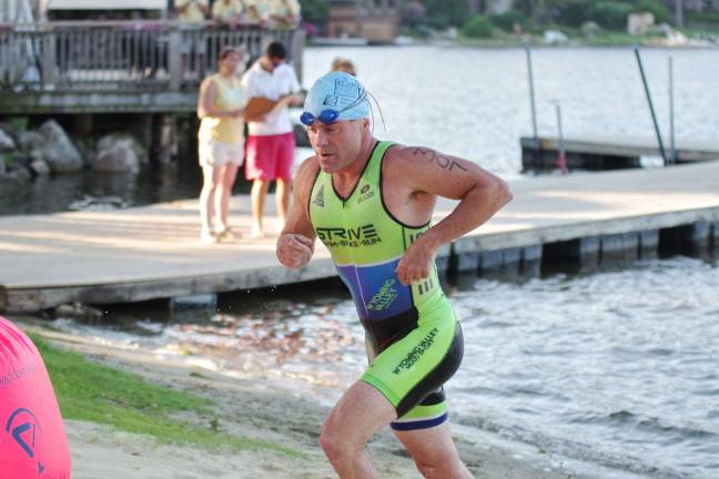 Another big triathlon for Pass it Along Fifty one year old triathlete John Mcgurk of Dallas, Pennsylvania finished in 8th place overall with a time of 1:07:05.