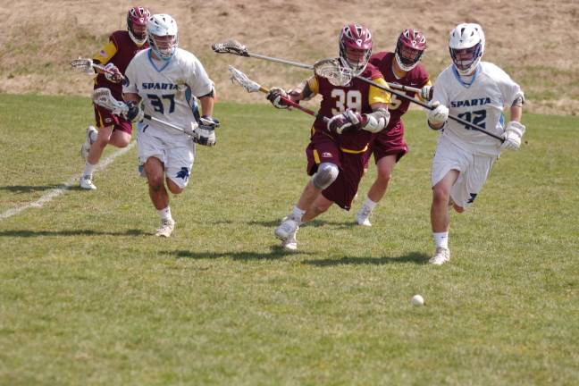 Summit tops Sparta in boys lacrosse Spartans and Hilltoppers chasing the ball.