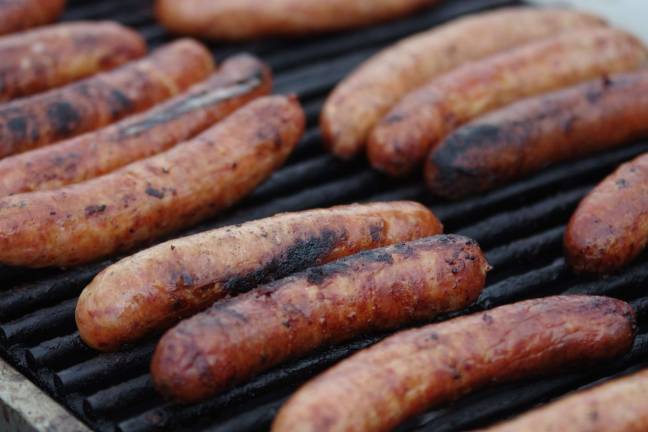 Crawfish fest goes 'down home' Sausages on the grill.