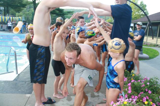 Lake Mohawk swimmers defeat West Milford Jarrod Schwesinger, 18, gets cheered on by fellow Lake Mohawk Pool swimmers as he gets ready to swim his last meet as a Hawk.