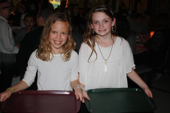 Kids serve parents at Annual Spaghetti Dinner Busy bussers Bella Biondo and Victoria Sucich