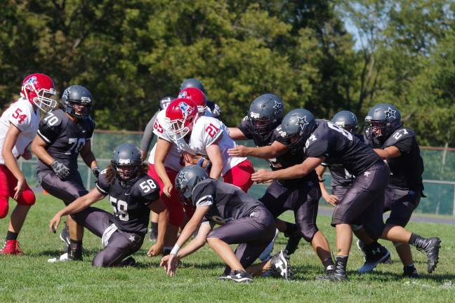 Lenape Valley smothers Wallkill in high school football A Lenape Valley ball carrier moves the ball through a pack of Wallkill Valley defenders.