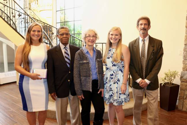 Sparta seniors receive scholarships Smile Award-Knight Family Scholarship - Bayleigh Takacs, Mr. and Mrs. Knight, Sophia Sandgran, Andrew Lowery