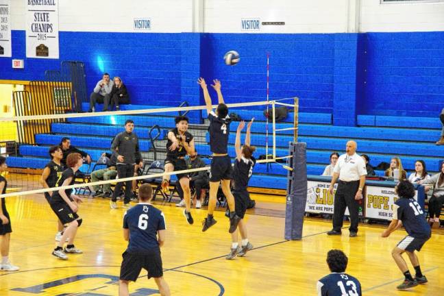 The Pope John Lions and Bergen Charter Yellow Jackets battle on the court.