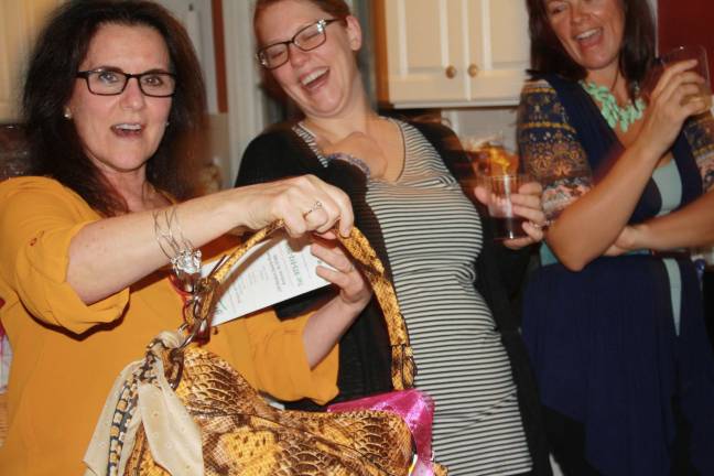 Christine Villamor wins new handbag and scarf donated by Robyn Bivona