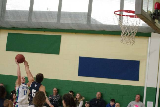 Camden beats Sussex in girls hoops Sussex County's Brenley Knakkagaard takes a shot while covered by Camden's Layne Olsen. Knakkagaard scored ten points.