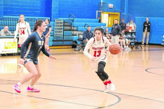 Newark Academy's Dagny Slomack dribbles the ball while covered by Pope John's Kaitlyn Platt. (Photo by George Leroy Hunter)