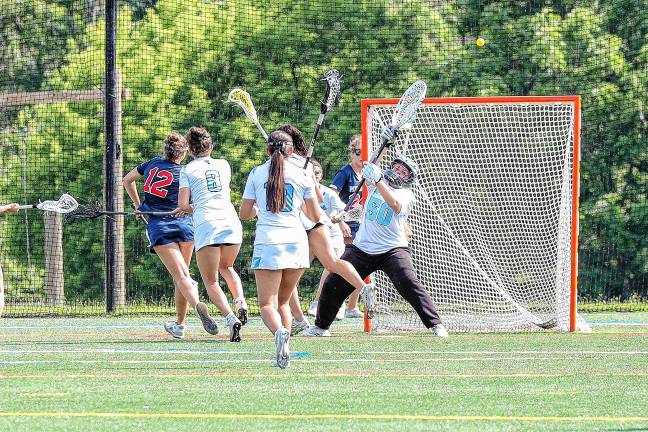 Photos: Spartans in Group 2 final Amelia Eichman of Sparta fires a wide shot on Sparta’s Callie Maines.