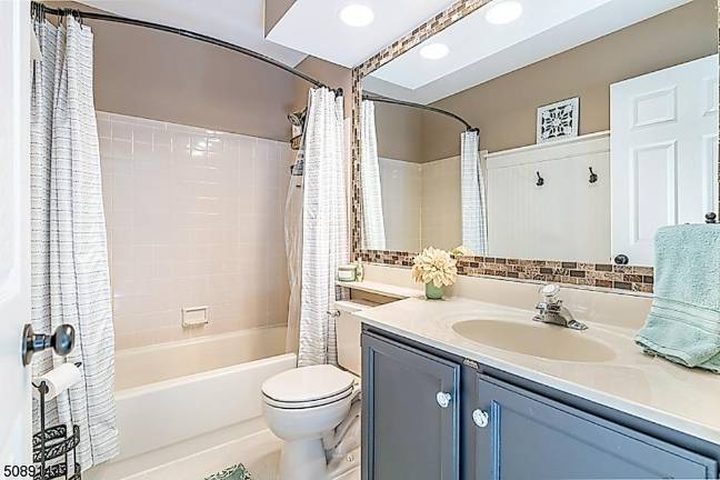 Home with classic beauty is nestled in a mature landscape Home with classic beauty is nestled in a mature landscape
