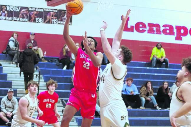 Lenape Valley's Gabriel Quarranttey takes the ball toward the hoop as Sussex Tech's Dane Walker defends. Quarranttey scored seven points.