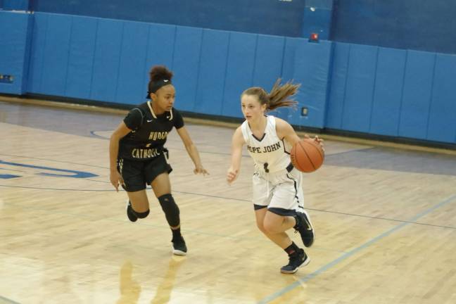 Hudson Catholic beats Pope John in girls hoops Pope John's Fitzmorris with the ball as Hudson Catholic's Zanai Jones keeps pace.