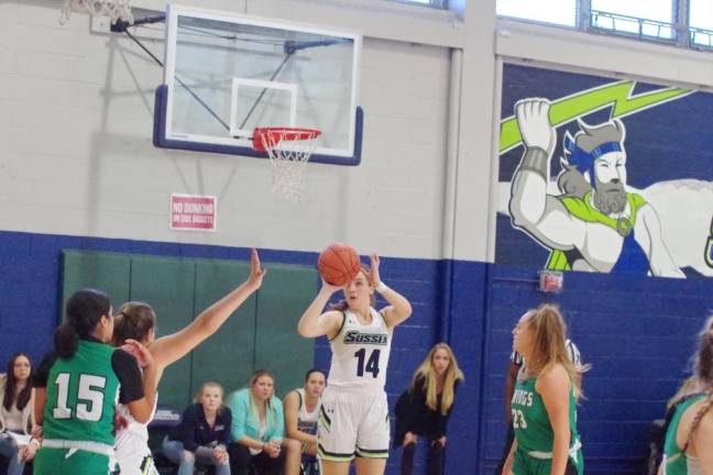 Sussex County's Kristen Burse aims the ball at the hoop just before releasing it during a shot attempt in the third quarter.