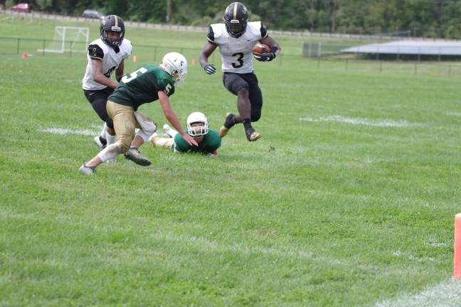 Hudson Catholic ball carrier Hasan Dominick on the move in the third quarter. Dominick achieved two rushing touchdowns in the contest.