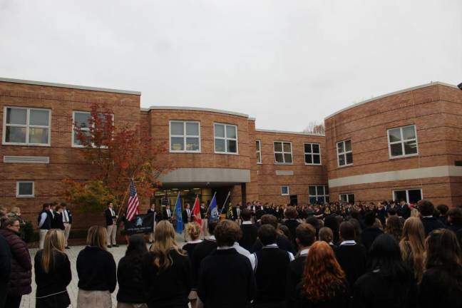 Father Michael Parisi told the students about his service in the Navy Chaplain Corps.