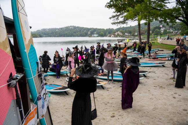 Participants in the Witches Paddle gather on the beach before setting off Saturday, Sept. 30. (Photo by Nancy Madacsi)