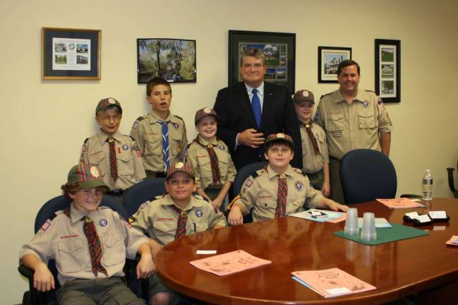 Scouts dish out in soup kitchen Thomas, Jonathan, Anthony, Erik, Andy and Andrew, their Den Chief, and Den Leader Wayne Ring visited State Senator Steve Oroho in his Sparta office.