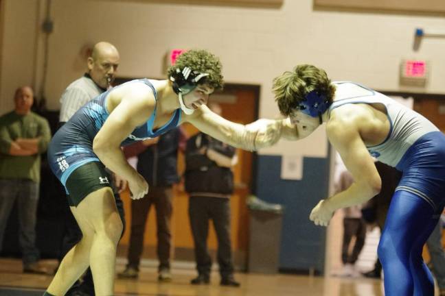 Sparta’s Lucas Brown, left, faces Kittatinny’s Alex Laoudis in the 215-pound weight class. Brown won by ultimate tie breaker, 3-2.