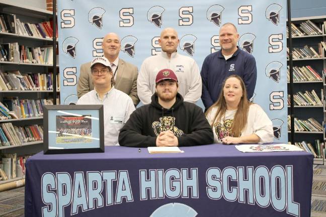 Peterson to play football at Kutztown Sparta High School senior Hunter Peterson, seated center, will play football next fall at Kutztown (Pa.) University. Seated with him are his parents, Chris and Kim. Back row from left are Principal Ed Lazarra, head football coach Frank Marchiano and athletic director Steve Stoner. (Photo provided)