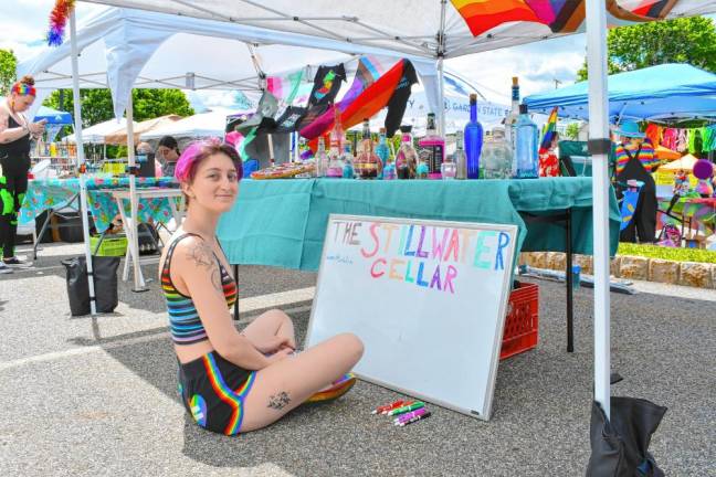 Photos: Sussex County Pride Celebration Nina Bennett of Stillwater works on a sign for her booth.