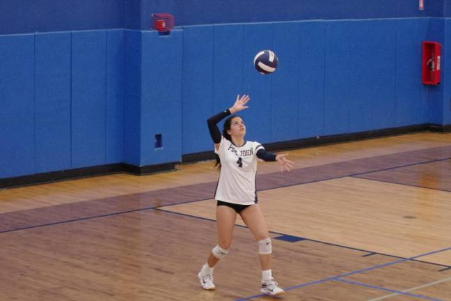 Pope John's Lian Vieluf is in the midst of a serve. She had four kills, one block, seven digs and one ace.