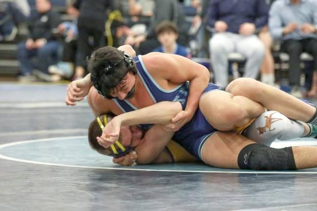 Nick Hwang puts a winning squeeze on his opponent at Saturday's tournament.