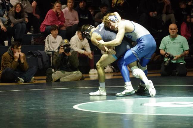 Sparta’s Eugene Donnelly grapples with Kittatinny’s Jacob Savage, right, in the 144-pound weight class. Savage won by decision, 7-0.