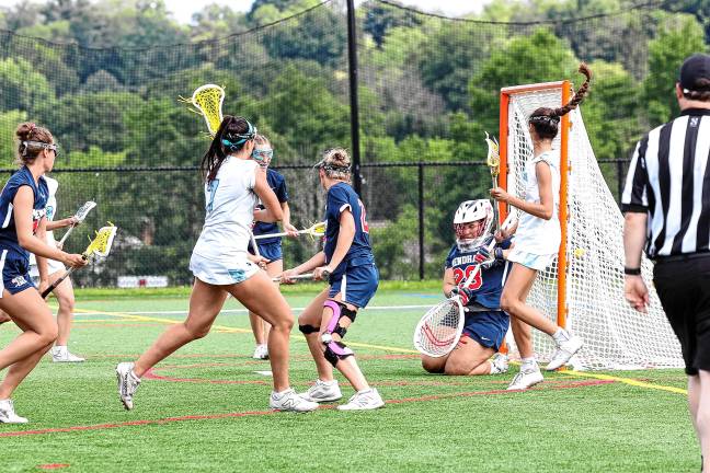 Photos: Spartans in Group 2 final Sparta’s Uma Kowalski follows through on a shot on Mendham’s Sabrina Saunders in the first half.