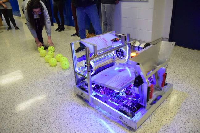 High school robotics teams 'turn gears' for competition Newton and Vernon represent Sussex County Vernon High School robotics team students testing the robot in action Photo by Abigail Dayon