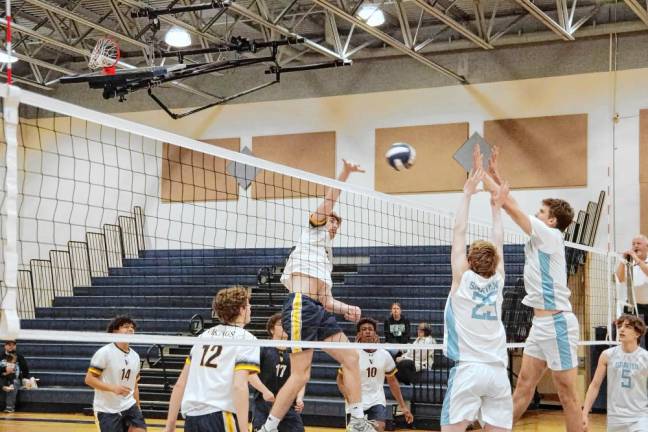 Vernon's Ben Jurewicz strikes the ball toward the Sparta players.