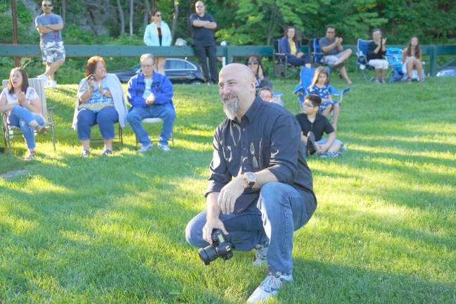 Photographer and substitute teacher Paul Michael Kane smiles at the graduates. (Photo by Vera Olinski)