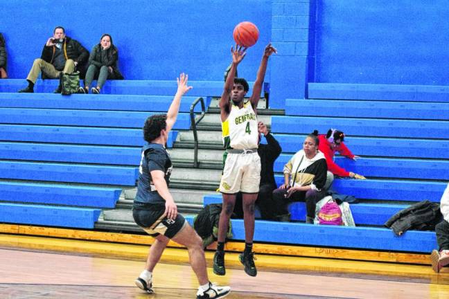 University Academy's Jeremiah Siland releases the ball in a long-range shot. He scored five points.