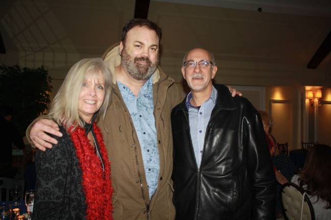 Laughter on the lakeside Donna and Mark Staccioli with Chris Roach (center) at Lake Mohawk Country Club. Photos by Rose Sgarlato