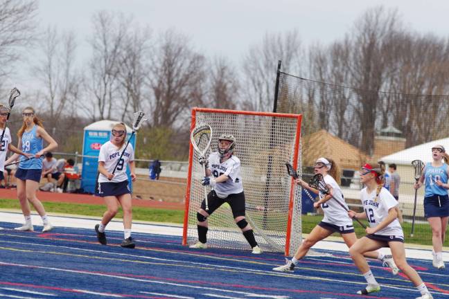 Mead leads Sparta girls to lacrosse victory over Pope John Pope John goal keeper Kayla Brutosky stands guard in front of the goal post. Brutosky made twelve saves. Photos by George leroy Hunter