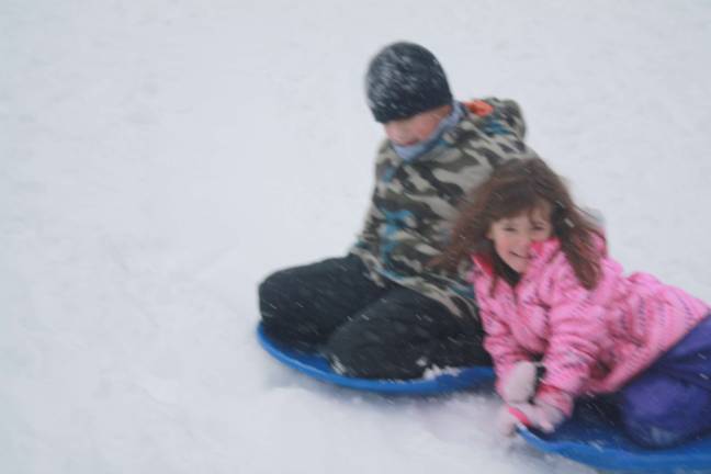'Historic' storm never comes, but Sparta still digs out Aiden Olarte and Faith Cruz enjoying the snow.