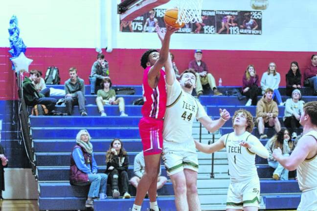 Lenape Valley's Gabriel Quarranttey takes the ball toward the hoop as Sussex Tech's Dane Walker defends. Quarranttey scored seven points.