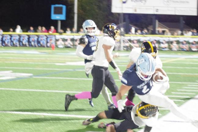 Sparta ball carrier Lucas Brown gets knocked out of bounds by a West Milford defender in the first half. Brown made one rushing touchdown and one receiving touchdown.